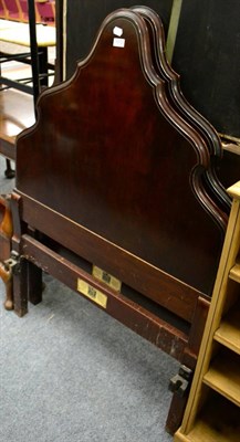 Lot 1072 - A pair of early 20th century walnut bedsteads labelled Maple & Co, the footboards with scrolled...