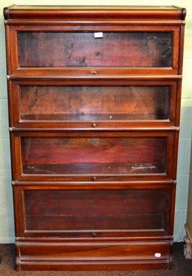 Lot 1203 - A Globe Wernicke four height sectional glazed bookcase on cushion shaped base