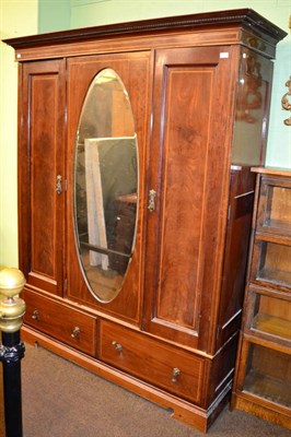 Lot 1206 - An Edwardian triple door wardrobe