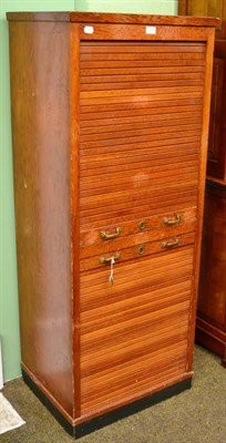 Lot 1208 - A tambour front filing cabinet