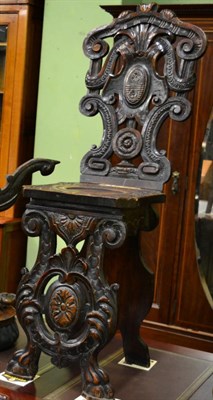 Lot 1213 - An Italian carved walnut sgabello chair