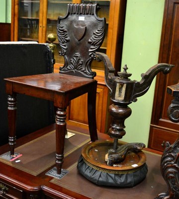 Lot 1214 - A Victorian mahogany hall chair and a revolving piano stool (one leg detached)