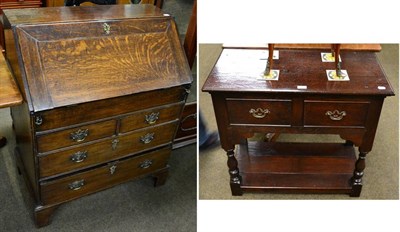 Lot 1218 - A bureau and a two drawer side table