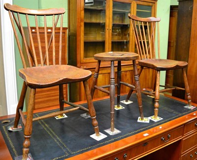 Lot 1219 - A pair of country stick back kitchen chairs with elm seats and a similar stool (3)