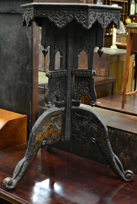 Lot 1221 - An Indian carved hardwood side table with elephant head supports