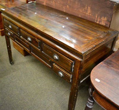 Lot 1232 - A 20th century sideboard with three long drawers above two short drawers