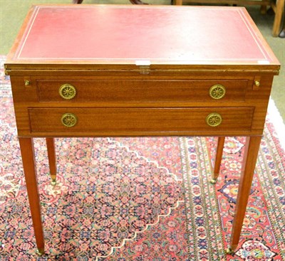 Lot 1242 - An early 20th century mahogany foldover writing table, with hinged leather writing surface and...