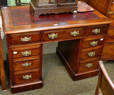 Lot 1247 - A mahogany twin pedestal desk with leather inset top afixed with a later label inscribed...