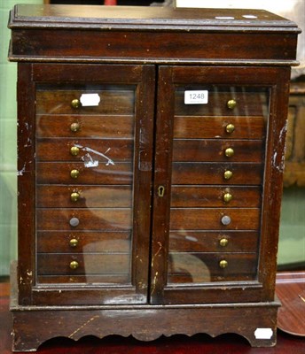 Lot 1248 - A table top collectors cabinet with ten drawers with removable coin inserts