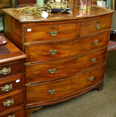 Lot 1249 - A mahogany bow front four height chest of drawers on bracket feet