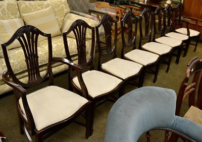 Lot 1255 - A set of eight Hepplewhite style mahogany dining chairs, early 20th century, including two...