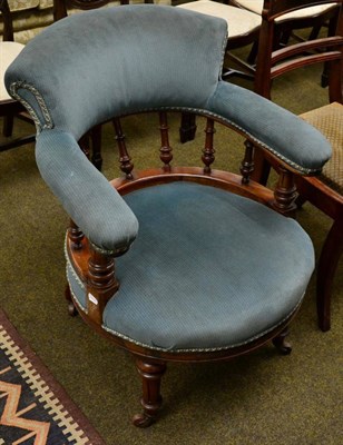 Lot 1256 - A Victorian mahogany low open armchair the circular seat on turned and fluted supports