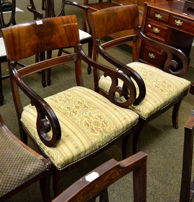 Lot 1258 - A pair of mahogany armchairs with saber shaped legs