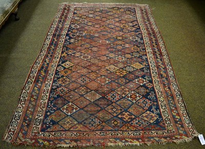 Lot 1270 - Jaff Sandjabi Kurd rug, West Iran, the polychrome diamond lattice field enclosed by narrow borders