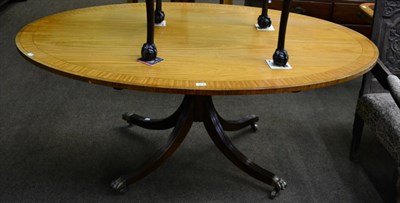 Lot 1278 - A reproduction satinwood and crossbanded oval dining or breakfast table, in George III style,...