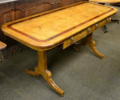 Lot 1285 - A burr walnut and cross banded sofa table fitted with two drawers, and lion mask drop ring handles