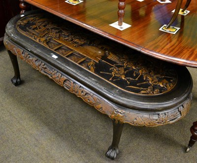 Lot 1289 - A Chinese carved oval coffee table