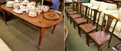 Lot 1315 - A mahogany extending dining table with single leaf, on turned and fluted supports, with a set...