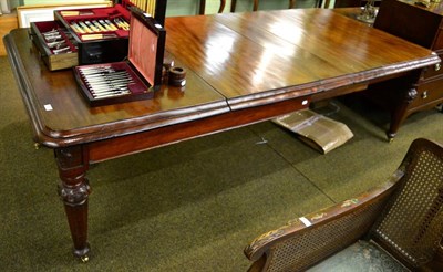 Lot 1318 - A large Victorian mahogany extending dining table, three leaves, raised on tapered faceted legs...