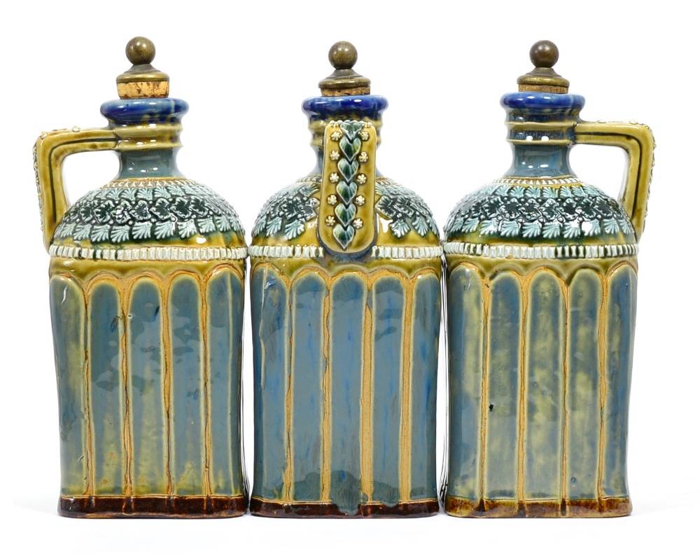 Lot 40 - A Doulton Lambeth Stoneware Decanter Set, the three decanters have W, B and G to the top of the...