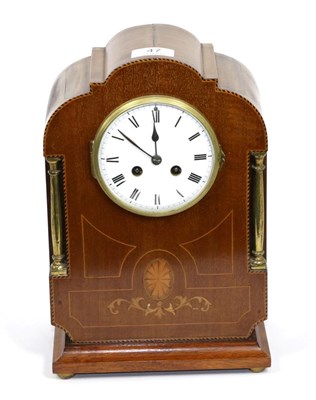 Lot 47 - An Edwardian mahogany inlaid striking mantle clock