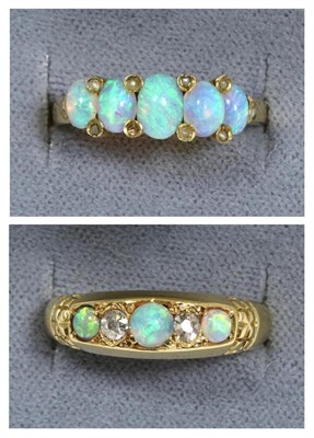 Lot 59 - An 18 carat gold opal and diamond ring, three graduated round cabochon opals, spaced by old cut...
