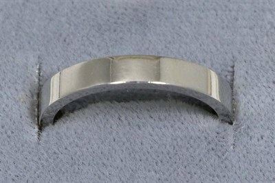 Lot 63 - A flat sided platinum band ring, finger size M1/2