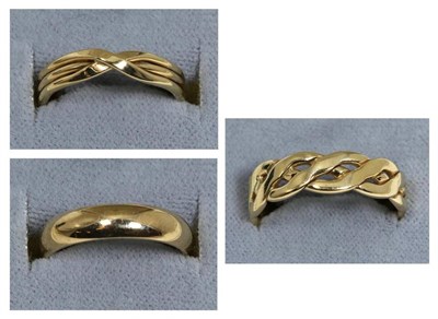 Lot 75 - A 9 carat gold celtic scroll band ring, finger size V; a 9 carat gold crossover band ring,...