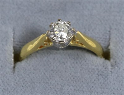 Lot 77 - An 18 carat gold solitaire diamond ring, a round brilliant cut diamond in a claw setting, to...