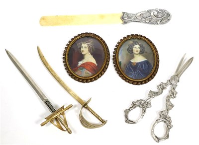 Lot 91 - A silver and ivory page turner, two portraits, grape scissors and two letter openers