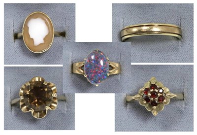 Lot 93 - A 9 carat gold smokey quartz ring, a round cut smokey quartz in a claw setting, to an extended...