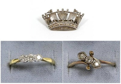 Lot 112 - An 18 carat gold diamond three stone ring, graduated round brilliant cut diamonds in claw...
