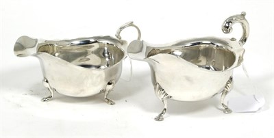Lot 116 - A George III style silver sauceboat, Jay, Richard Attenborough Co, Sheffield 1913; together...