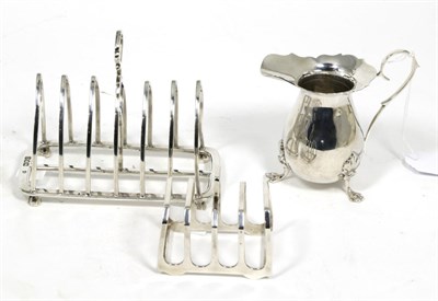 Lot 118 - A silver toast rack, London 1901; another smaller example, Elkington, 1935; and a George III...