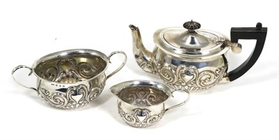 Lot 122 - An Art Nouveau silver three piece tea service, Henry Charles Freeman, Birmingham 1899/1904, the...