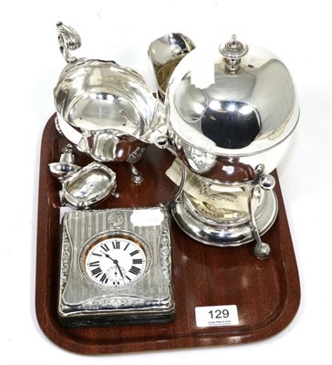 Lot 129 - A silver mounted cased travelling timepiece, a silver cream jug and plated wares