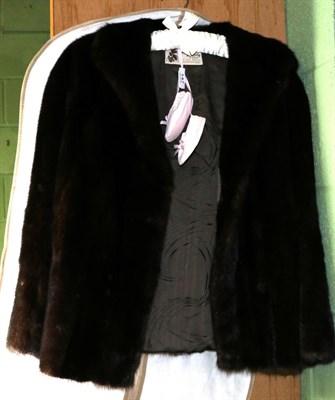 Lot 147 - Dark brown mink short jacket, labelled 'Mister Monty Furs', with slit pockets and initials 'M J...