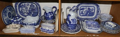 Lot 156 - A quantity of blue and white ceramics including meat plates, jugs, plates, etc (two shelves)