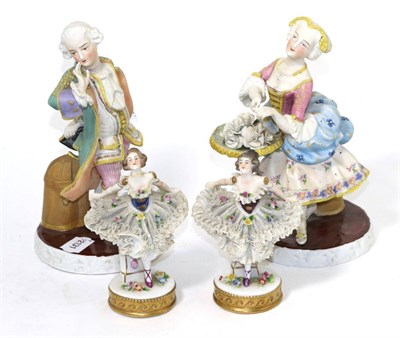 Lot 183 - A pair of 18th century style bisque figures of a dandy and flower seller; with two Dresden...