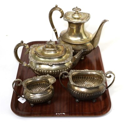 Lot 185 - A composite four piece silver teaset, by Roberts & Belk, Sheffield, various dates of gadrooned form