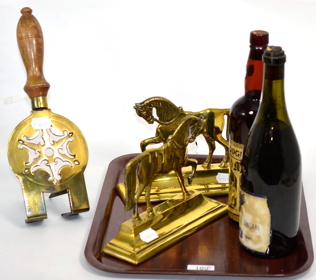 Lot 189 - Pair of brass horse fire side ornaments; cap badge; World War II tankard; port; etc (two trays)