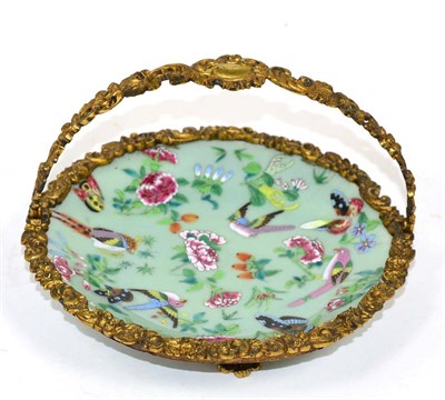 Lot 198 - An 19th century, Chinese export enamel painted celadon dish with ormolu swing handle and mount