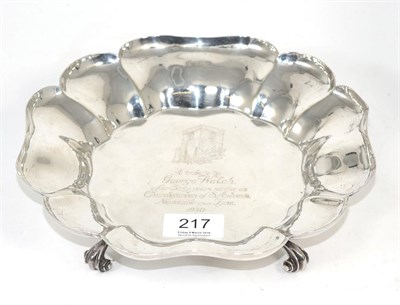 Lot 217 - A shaped circular silver bowl, Thomas Bradbury, Sheffield 1930, on four scroll supports, with...