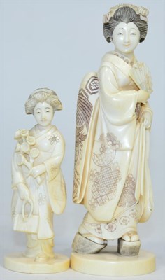 Lot 221 - A Japanese Meiji period ivory okimono of a Geisha, red seal mark, 17 cm in height; together...