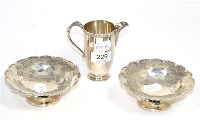 Lot 229 - A pair of silver bonbon dishes, Mappin & Webb, Sheffield 1931, with scale decoration; and a...