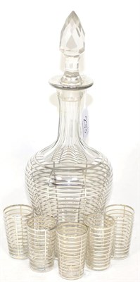 Lot 233 - An early 20th century white metal clad liqueur decanter with five glasses (6)