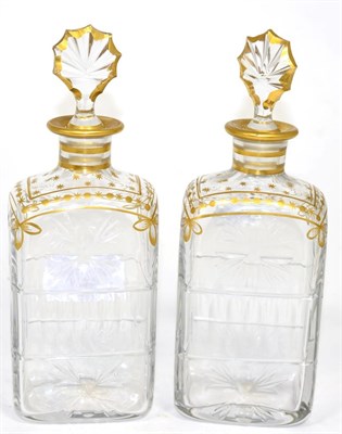 Lot 237 - A pair of Daum cut glass decanters, with gilt decoration, gilt edged stoppers, signed Daum Cross of