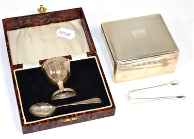 Lot 239 - A silver cigarette box; Goldsmith & Silversmith Co., London, 1947; together with an egg cup and...