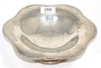 Lot 265 - A silver sauce boat and a silver baluster caster