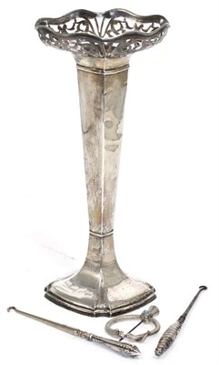 Lot 267 - An early 20th century silver trumpet vase, Chester 1912; with two button hooks and a Scottish...